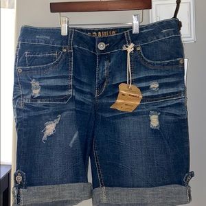 Medium length distressed jean shorts